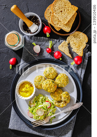 baked meat and vegetable polpette on a plate 139910486