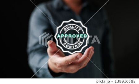 Businessman hand holding virtual quality control approved sign. Concept of standard certification, guarantee service, product excellence, business satisfaction and iso system strategy. Businessman hand holding virtual quality control approved sign. Concept of standard certification, guarantee service, product excellence, business satisfaction and iso system strategy. 139910588