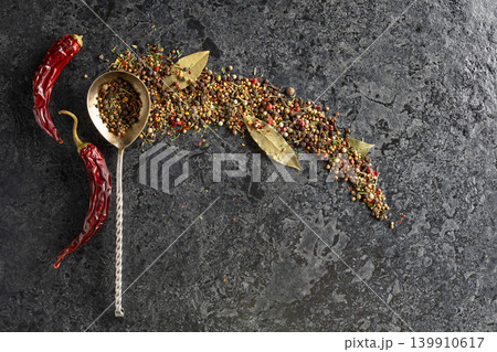 Mix of organic dried spices on a black stone background. 139910617