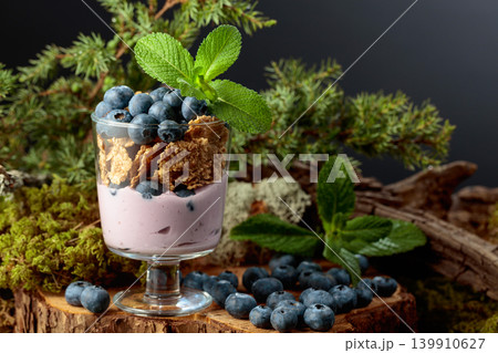 Blueberry dessert with rye flakes and fresh berries. Blueberry dessert with rye flakes and fresh berries. 139910627