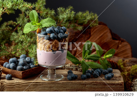 Blueberry dessert with rye flakes, mint and fresh berries. Blueberry dessert with rye flakes, mint and fresh berries. 139910629