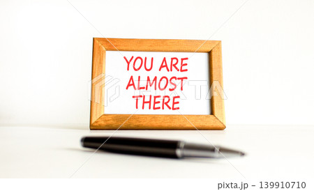 You are almost there words symbol. Concept words You are almost there on beautiful picture frame. Beautiful white background. Business You are almost there motivational support concept. Copy space. You are almost there words symbol. Concept words You are almost there on beautiful picture frame. Beautiful white background. Business You are almost there motivational support concept. Copy space. 139910710