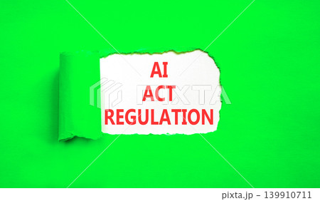 AI act regulation words symbol. Concept words AI artificial intelligence act regulation on beautiful white paper. Beautiful green background. Business AI act regulation concept. Copy space. AI act regulation words symbol. Concept words AI artificial intelligence act regulation on beautiful white paper. Beautiful green background. Business AI act regulation concept. Copy space. 139910711