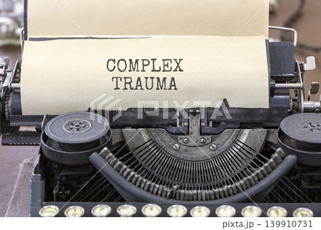 Complex trauma words symbol. Concept words Complex trauma typed on beautiful old retro typewriter. Beautiful white background. Psychological complex trauma support concept. Copy space. Complex trauma words symbol. Concept words Complex trauma typed on beautiful old retro typewriter. Beautiful white background. Psychological complex trauma support concept. Copy space. 139910731