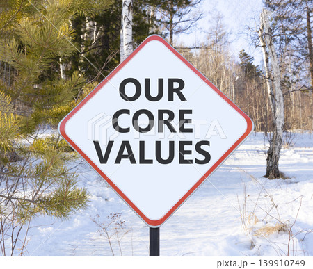 Our core values words symbol. Concept words Our core values on beautiful white road sign. Beautiful winter forest background. Business our core values motivational support concept. Copy space. Our core values words symbol. Concept words Our core values on beautiful white road sign. Beautiful winter forest background. Business our core values motivational support concept. Copy space. 139910749