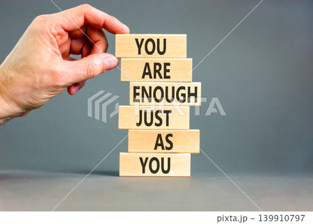 You are enough symbol. Concept words You are enough just as you on beautiful wooden sticks. Beautiful grey background. Business motivational and you are enough just as you concept. Copy space. 139910797