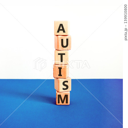 Autism medical symbol. Concept word Autism on beautiful wooden blocks. Beautiful blue and white background. Business autism medical concept. Copy space. Autism medical symbol. Concept word Autism on beautiful wooden blocks. Beautiful blue and white background. Business autism medical concept. Copy space. 139910800