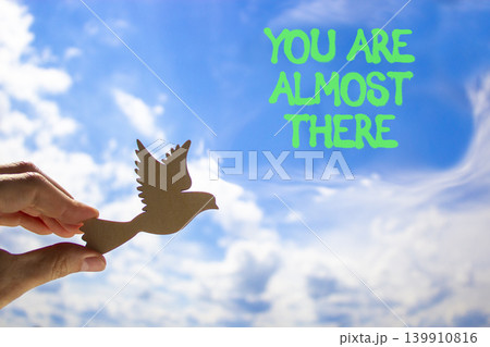 You are almost there words symbol. Concept words You are almost there on beautiful blue sky. Beautiful blue sky background. Business You are almost there motivational support concept. Copy space. 139910816