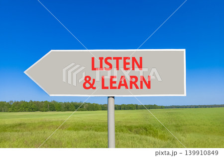 Listen and learn words symbol. Concept words Listen and learn on beautiful grey road sign. Beautiful blue sky green field background. Business listen and learn support concept. Copy space. Listen and learn words symbol. Concept words Listen and learn on beautiful grey road sign. Beautiful blue sky green field background. Business listen and learn support concept. Copy space. 139910849