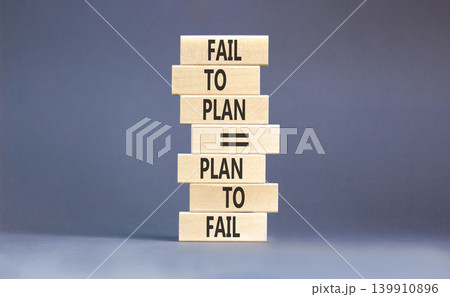 Planning to fail symbol. Concept words Fail to plan is plan to fail on beautiful wooden blocks. Beautiful grey paper background. Business planning to fail concept. Copy space. Planning to fail symbol. Concept words Fail to plan is plan to fail on beautiful wooden blocks. Beautiful grey paper background. Business planning to fail concept. Copy space. 139910896