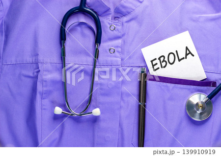 Ebola virus medical words symbol. Concept word Ebola on beautiful white paper. Beautiful medical uniform background. Stethoscope. Medical Ebola virus concept. Copy space. Ebola virus medical words symbol. Concept word Ebola on beautiful white paper. Beautiful medical uniform background. Stethoscope. Medical Ebola virus concept. Copy space. 139910919