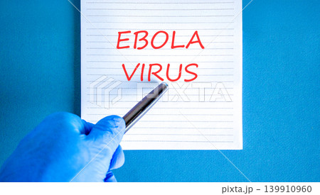 Ebola virus medical words symbol. Concept word Ebola virus on beautiful white note. Beautiful blue background. Doctor hand in blue medical glove. Black pen. Medical Ebola virus concept. Copy space. Ebola virus medical words symbol. Concept word Ebola virus on beautiful white note. Beautiful blue background. Doctor hand in blue medical glove. Black pen. Medical Ebola virus concept. Copy space. 139910960