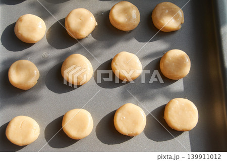 Unbaked Cookie Dough Balls on Baking Sheet Unbaked Cookie Dough Balls on Baking Sheet 139911012