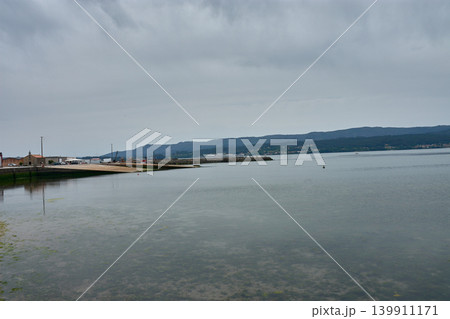 Clean docks and piers awaiting boats in the Rianxo maritime port in Galicia Clean docks and piers awaiting boats in the Rianxo maritime port in Galicia 139911171