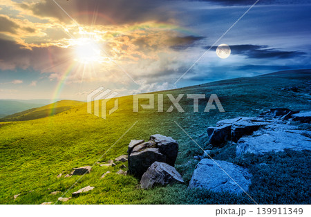day meet night. mountain landscape with alpine meadow. sun and moon over carpathian mountain scenery on summer solstice. view in to the distant valley landscape. rolling hills and grassy meadow day meet night. mountain landscape with alpine meadow. sun and moon over carpathian mountain scenery on summer solstice. view in to the distant valley landscape. rolling hills and grassy meadow 139911349
