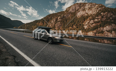 Car with roof rack travel on mountain road Car with roof rack travel on mountain road 139913222