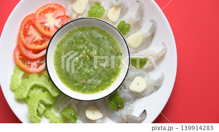 shrimp in fish sauce with Thai spicy seafood dipping sauce on white plate 139914283