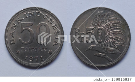An old Indonesian 50 Rupiah coin from 1971 depicting the Bird of Paradise. An old Indonesian 50 Rupiah coin from 1971 depicting the Bird of Paradise. 139916937
