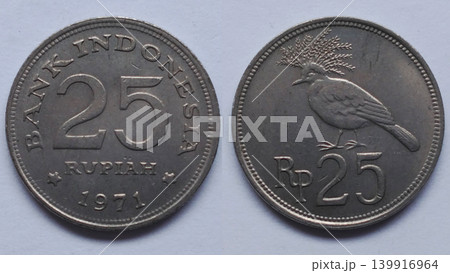 An old Indonesian 25 Rupiah coin from 1971 depicting the Bird of Paradise. An old Indonesian 25 Rupiah coin from 1971 depicting the Bird of Paradise. 139916964