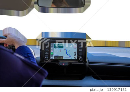 Driver hand on steering wheel with car navigation system dashboard screen displaying map, vehicle interior isolated on transparent background. High quality photo Driver hand on steering wheel with car navigation system dashboard screen displaying map, vehicle interior isolated on transparent background. High quality photo 139917181