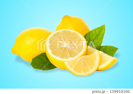 Fresh lemons and green leaves on a blue background Fresh lemons and green leaves on a blue background 139918100