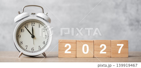 Happy New Year with vintage alarm clock and 2027 block. Christmas, New Start, Resolution, countdown, Goals, Plan, Action and Motivation Concept Happy New Year with vintage alarm clock and 2027 block. Christmas, New Start, Resolution, countdown, Goals, Plan, Action and Motivation Concept 139919467