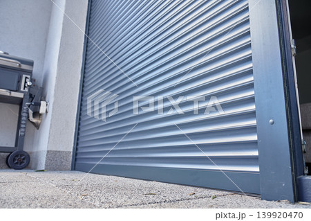 Closed exterior roller shutter on modern house window Closed exterior roller shutter on modern house window 139920470