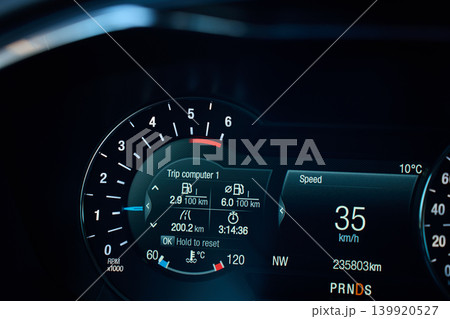 Illuminated car dashboard with tachometer and digital speed display Illuminated car dashboard with tachometer and digital speed display 139920527