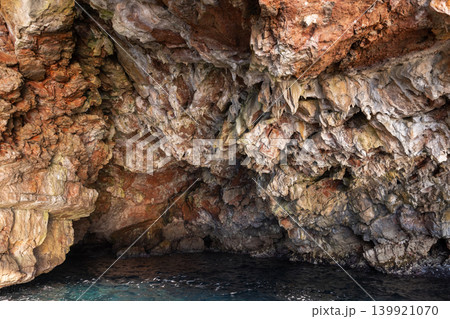 Textured rocky cave interior with rough natural formations and vivid colors 139921070