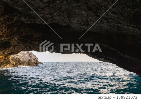 Montenegro, Blue lagoon. A picturesque sea cave frames a view of tranquil blue waters 139921072