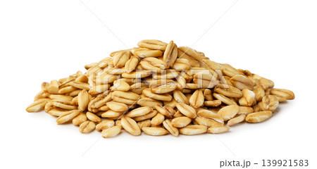 Pile of oat grains close-up on a white background. Isolated Pile of oat grains close-up on a white background. Isolated 139921583