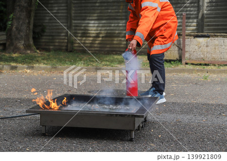 fire prevention. corporate safety - exercise during a firefighting course 139921809