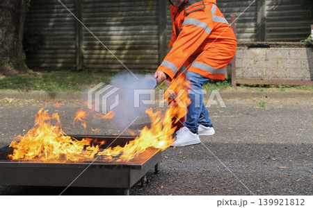 fire prevention. corporate safety - exercise during a firefighting course 139921812