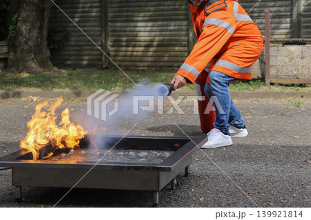 fire prevention. corporate safety - exercise during a firefighting course fire prevention. corporate safety - exercise during a firefighting course 139921814