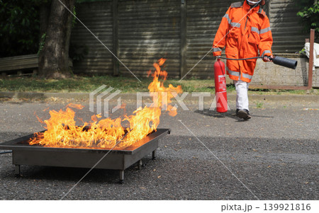 fire prevention. corporate safety - exercise during a firefighting course fire prevention. corporate safety - exercise during a firefighting course 139921816
