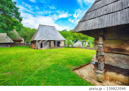 Remarkable summer scene of traditional romanian peasant houses. 139922046