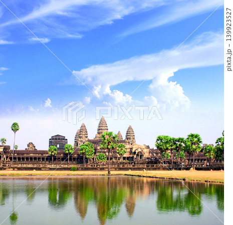 Famous landmark - temple complex Angkor Wat (Angkor Thom), Siem reap, Cambodia. Topic of tours, travel, trip abroad on vacation. Complex is a prominent symbol of Cambodia and a key tourist attraction Famous landmark - temple complex Angkor Wat (Angkor Thom), Siem reap, Cambodia. Topic of tours, travel, trip abroad on vacation. Complex is a prominent symbol of Cambodia and a key tourist attraction 139923527
