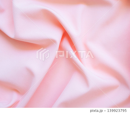 Background pink silk clouth wave abstract texture soft tablecloth cotton textile backdrop cosmetic beauty template presentation, silky velvet linen mockup cloth dress curtain backdrop clothing. Background pink silk clouth wave abstract texture soft tablecloth cotton textile backdrop cosmetic beauty template presentation, silky velvet linen mockup cloth dress curtain backdrop clothing. 139923795