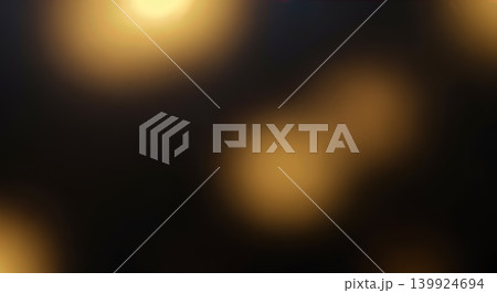 Blurred abstract dark background showing warm bright golden light bokeh circles glowing softly, creating elegant festive magical nighttime holiday celebration atmosphere design template 139924694