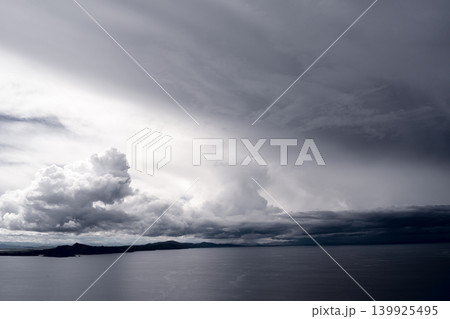 View of Lake Titicaca from Amantani Island under stormy clouds View of Lake Titicaca from Amantani Island under stormy clouds 139925495