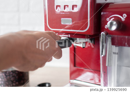 Preparing ground coffee for espresso machine at home 139925690