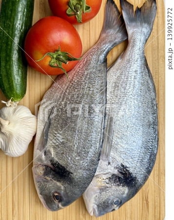 A close-up shot of raw fish, cooking delicious food at home. A close-up shot of raw fish, cooking delicious food at home. 139925772