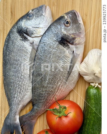 A close-up shot of raw fish, cooking delicious food at home. 139925773