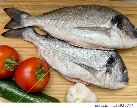 A close-up shot of raw fish, cooking delicious food at home. 139925774