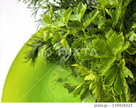 Fresh Parsley And Dill On Green Plate Fresh Parsley And Dill On Green Plate 139926025