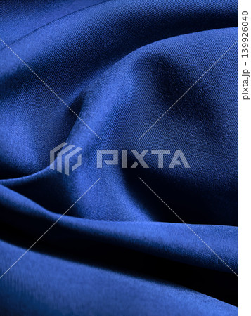 Blue Fabric Texture With Elegant Soft Folds Blue Fabric Texture With Elegant Soft Folds 139926040