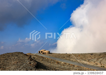 Concrete volcano shelter Amidst the volcanic ash. near Volcanic crater at the Mount Aso tourist viewpoint area, Japan. 139928437