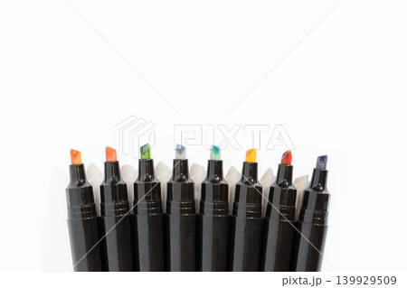 Colorful markers arranged in a neat row on a white background with copy space Colorful markers arranged in a neat row on a white background with copy space 139929509