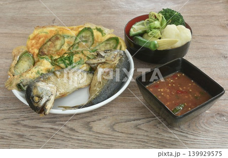 batter fried egg stuffed eggplant and cha-om couples mackerel with boiled vegetable on plate dipping spicy shrimp paste sauce 139929575
