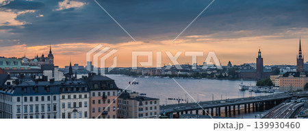 Stockholm Sweden Skyline with City Hall Stadshuset and Riddarholmen Church at Sunset with Bridges 139930460